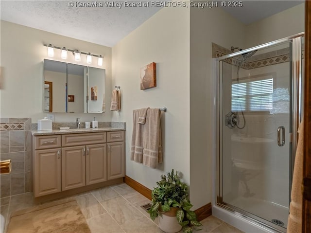 53 Wildrose Ln, Scott Depot, WV 25560 - full bathroom featuring a stall shower, vanity, and a textured ceiling