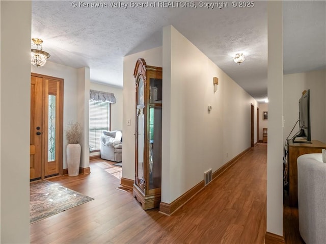 53 Wildrose Ln, Scott Depot, WV 25560 - entryway with a textured ceiling and wood finished floors