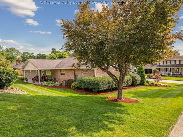 53 Wildrose Ln, Scott Depot, WV 25560 - view of front of house featuring a front yard and brick siding
