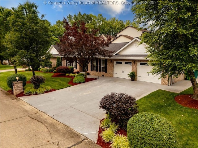 53 Wildrose Ln, Scott Depot, WV 25560 - obstructed view of property featuring a front lawn, driveway, an attached garage, and brick siding