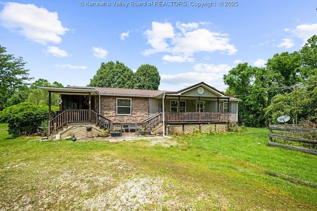 2873 Oak Hill Ridge Rd, Bomont, WV 25030 - back of property with covered porch, a lawn, a metal roof, stairway, and stone siding