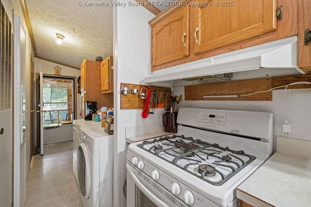 2873 Oak Hill Ridge Rd, Bomont, WV 25030 - kitchen with white gas range, under cabinet range hood, light countertops, a textured ceiling, and lofted ceiling