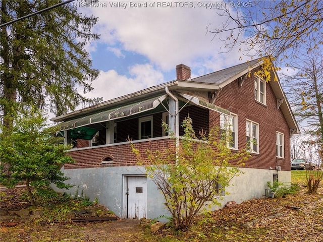 412 C St, Saint Albans, WV 25177 - view of side of property with brick siding and a chimney