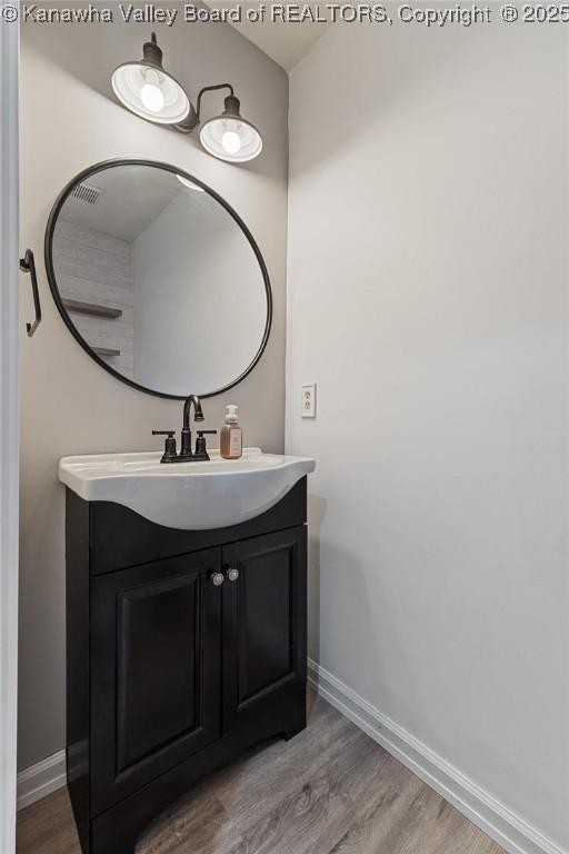 1571 Thistlewood Cir, Hurricane, WV 25526 - bathroom with vanity and wood finished floors