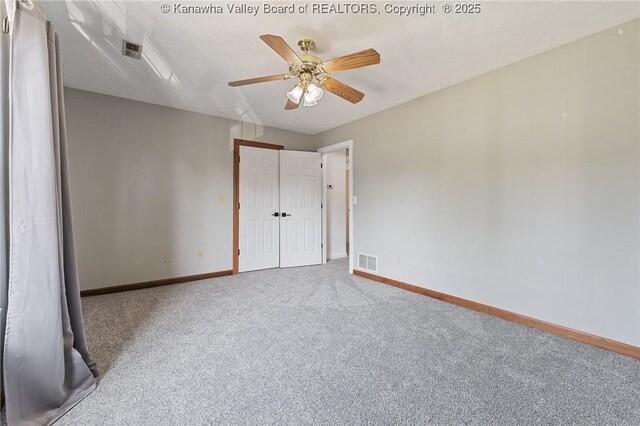 1571 Thistlewood Cir, Hurricane, WV 25526 - unfurnished bedroom with carpet flooring, a closet, and a ceiling fan