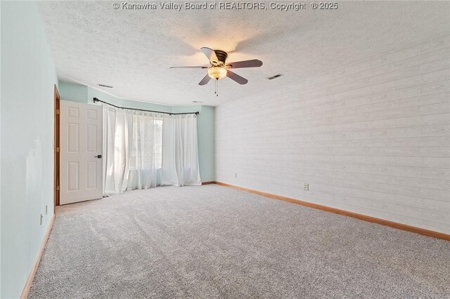 1571 Thistlewood Cir, Hurricane, WV 25526 - empty room with carpet floors, a textured ceiling, and a ceiling fan