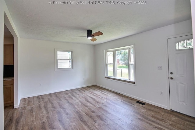 911 Dupont Ave, Nitro, WV 25143 - foyer featuring wood finished floors, a ceiling fan, and a textured ceiling