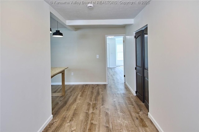 911 Dupont Ave, Nitro, WV 25143 - hallway featuring wood finished floors, beamed ceiling, and a textured ceiling