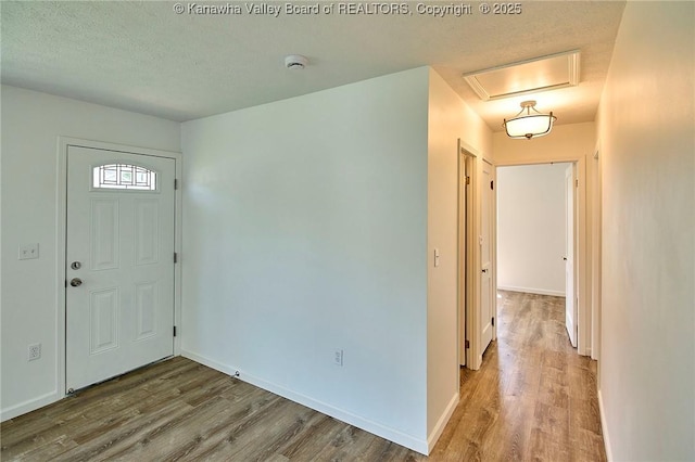 911 Dupont Ave, Nitro, WV 25143 - entryway with wood finished floors and a textured ceiling
