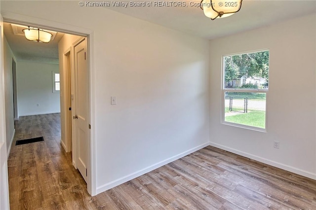 911 Dupont Ave, Nitro, WV 25143 - empty room featuring wood finished floors and baseboards