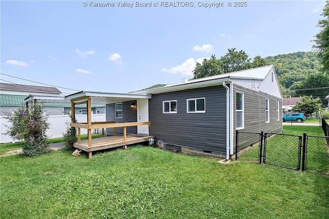 911 Dupont Ave, Nitro, WV 25143 - back of house featuring a deck, a gate, and crawl space