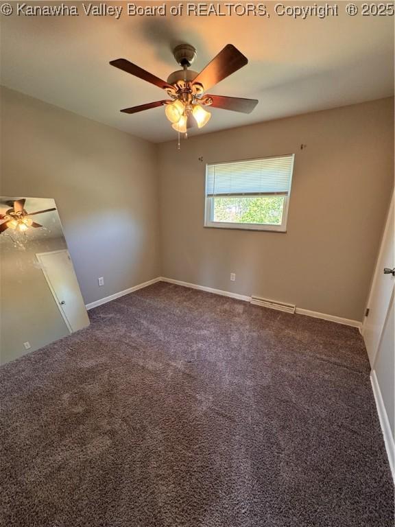 3007 Sansom Ct, Milton, WV 25541 - spare room featuring a ceiling fan and dark carpet