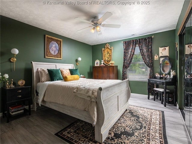 732 Jordan Pl, Nitro, WV 25143 - bedroom featuring wood finished floors, a textured ceiling, and a ceiling fan
