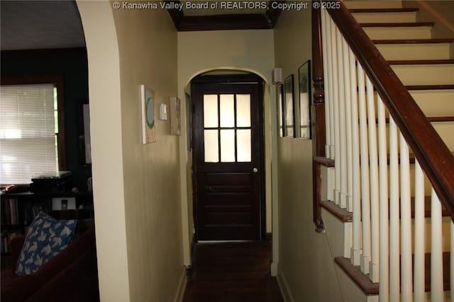 1840-A Oakridge Dr, Charleston, WV 25311 - foyer entrance featuring arched walkways, crown molding, stairway, and dark wood-style floors