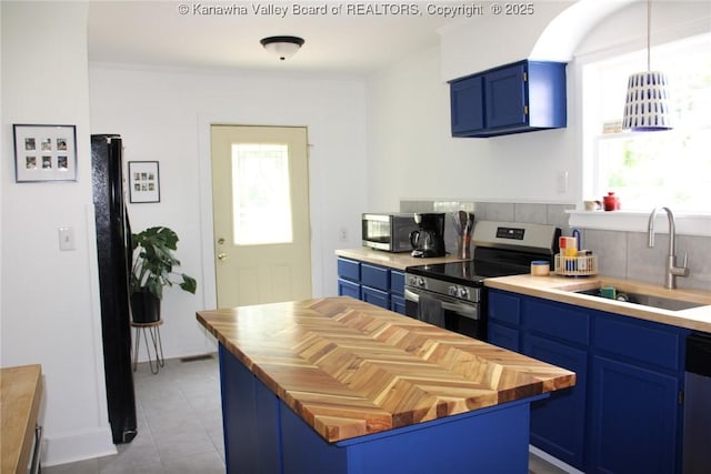 1840-A Oakridge Dr, Charleston, WV 25311 - kitchen featuring blue cabinets, electric range, butcher block counters, and light tile patterned flooring