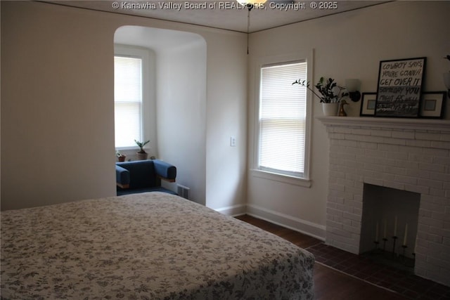 1840-A Oakridge Dr, Charleston, WV 25311 - bedroom featuring dark wood finished floors, a fireplace, and multiple windows