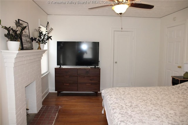 1840-A Oakridge Dr, Charleston, WV 25311 - bedroom featuring dark wood-type flooring, a brick fireplace, and a ceiling fan