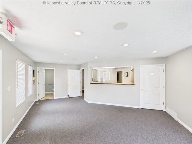 319 Main St, Clay, WV 25043 - unfurnished living room featuring carpet floors and recessed lighting