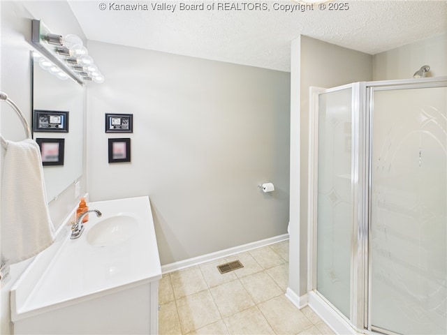 319 Main St, Clay, WV 25043 - bathroom featuring vanity, a stall shower, tile patterned flooring, and a textured ceiling