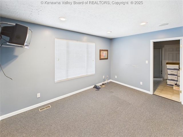 319 Main St, Clay, WV 25043 - unfurnished bedroom with carpet, a textured ceiling, and recessed lighting