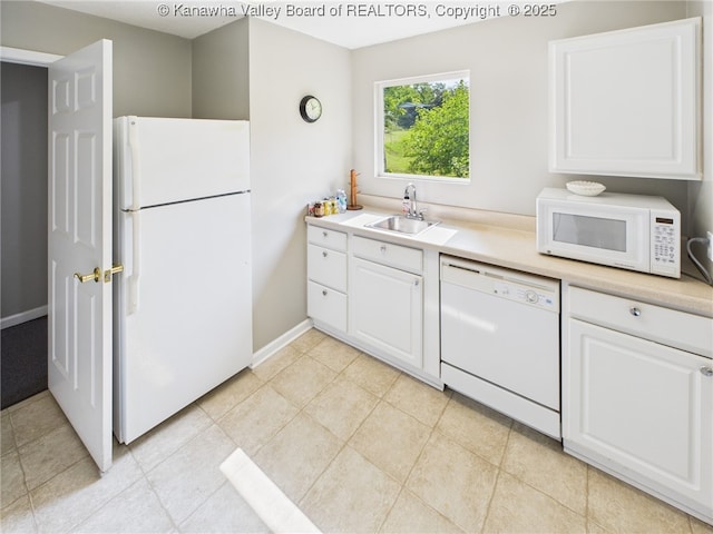 319 Main St, Clay, WV 25043 - kitchen with white appliances, white cabinets, and light countertops