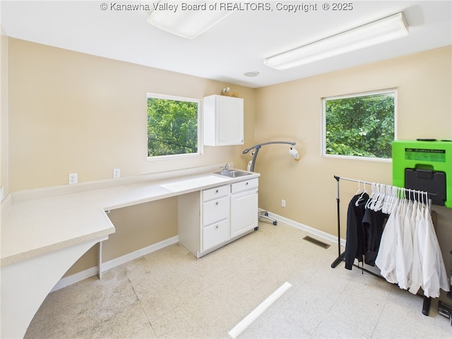 319 Main St, Clay, WV 25043 - laundry room featuring light flooring and a sink