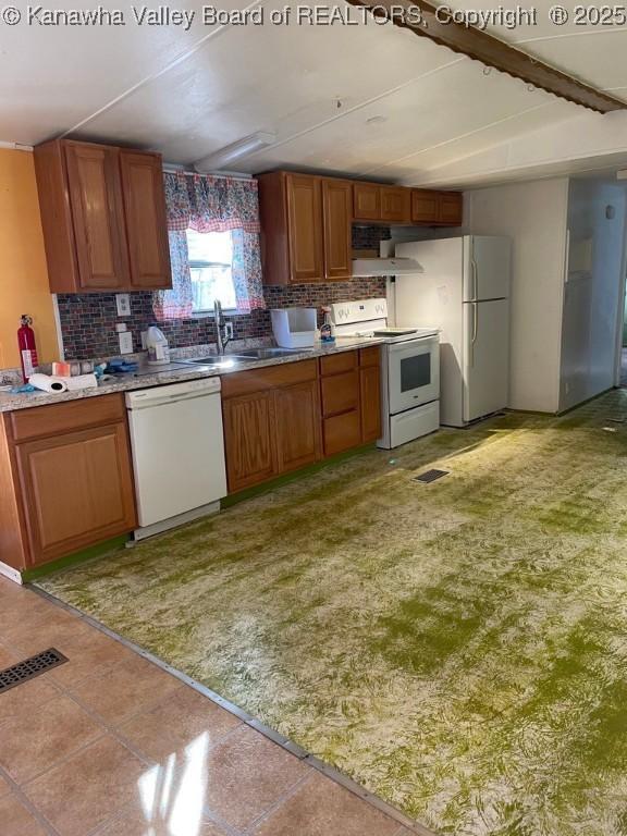 4208 Crede Dr, Charleston, WV 25302 - kitchen with white appliances, decorative backsplash, brown cabinets, and light countertops