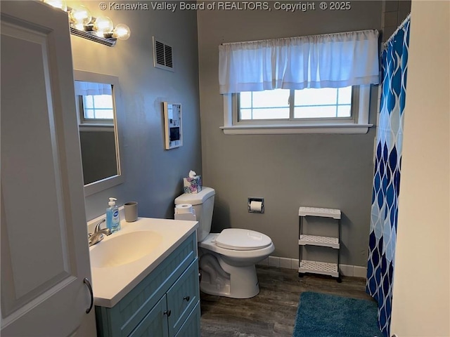 1524 Fenton Cir, Nitro, WV 25143 - bathroom with vanity, wood finished floors, and curtained shower