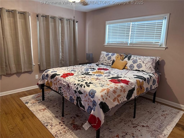 1524 Fenton Cir, Nitro, WV 25143 - bedroom with baseboards and wood finished floors