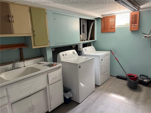 1524 Fenton Cir, Nitro, WV 25143 - washroom featuring cabinet space, separate washer and dryer, and light wood finished floors