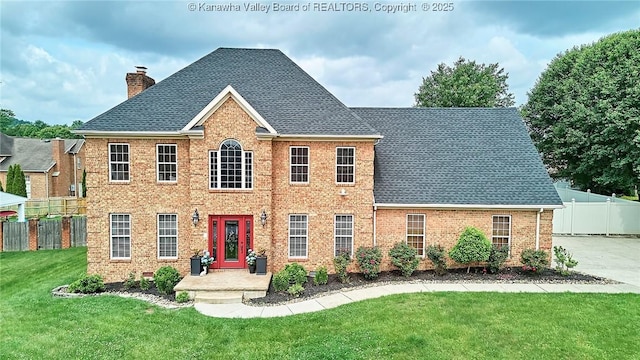 1004 Wethersfield Xing, Hurricane, WV 25526 - view of front of house featuring a chimney, roof with shingles, and brick siding
