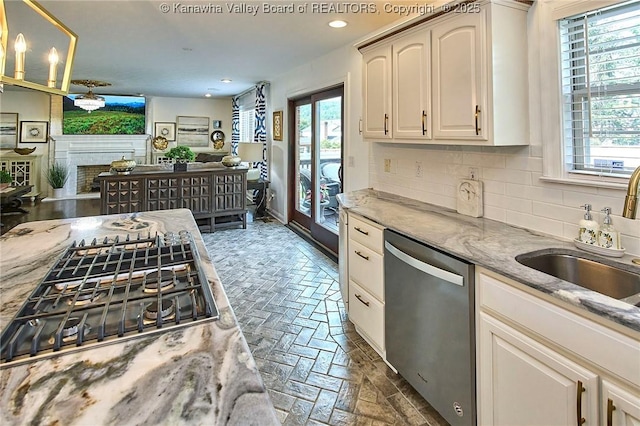 1004 Wethersfield Xing, Hurricane, WV 25526 - kitchen with stainless steel appliances, backsplash, recessed lighting, open floor plan, and light stone countertops