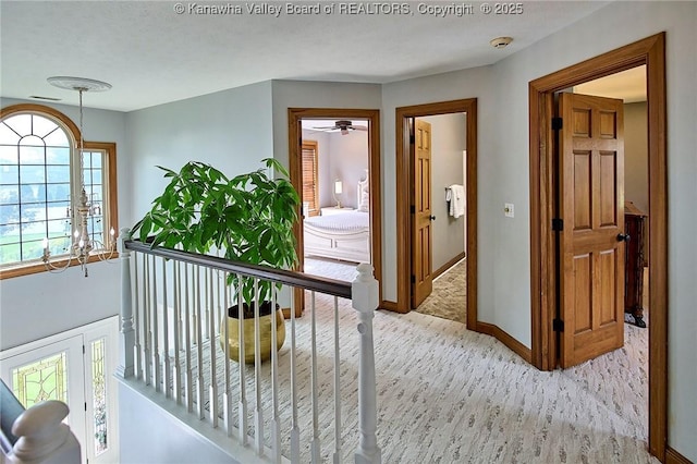 1004 Wethersfield Xing, Hurricane, WV 25526 - hallway featuring an upstairs landing and a chandelier