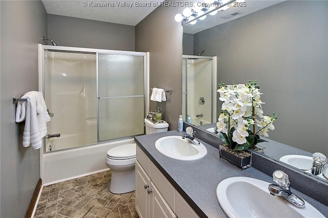 1004 Wethersfield Xing, Hurricane, WV 25526 - bathroom with double vanity and combined bath / shower with glass door