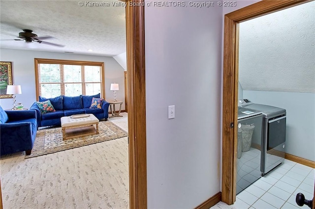 1004 Wethersfield Xing, Hurricane, WV 25526 - living room with washing machine and dryer, a textured ceiling, ceiling fan, lofted ceiling, and light tile patterned flooring