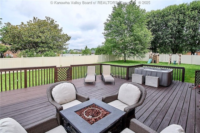 1004 Wethersfield Xing, Hurricane, WV 25526 - wooden terrace featuring an outdoor fire pit, a fenced backyard, and a playground
