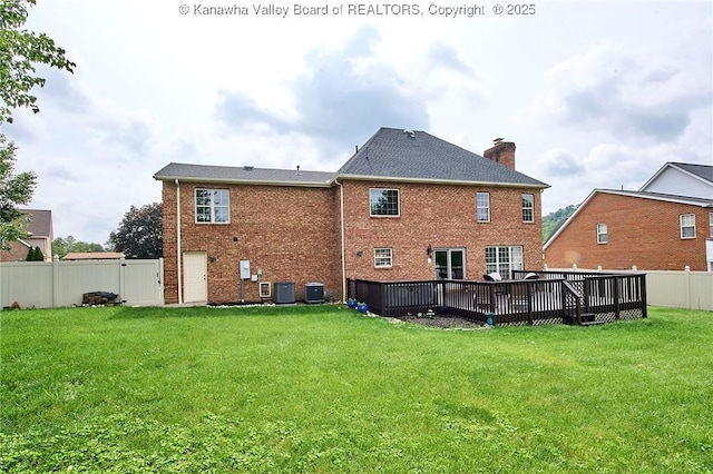 1004 Wethersfield Xing, Hurricane, WV 25526 - back of property with a fenced backyard, a chimney, a deck, and brick siding