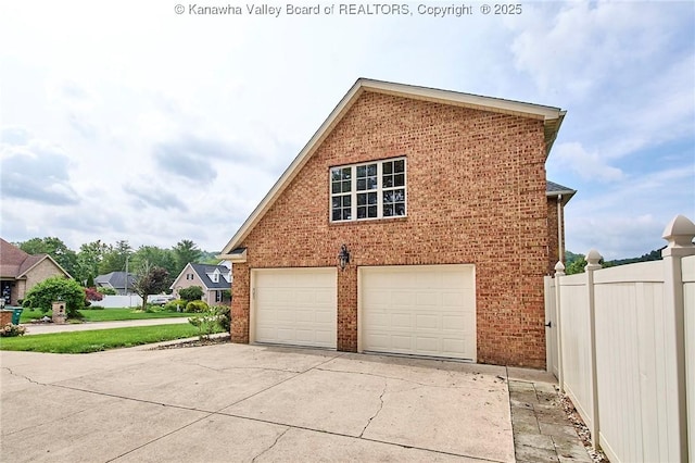 1004 Wethersfield Xing, Hurricane, WV 25526 - view of side of property featuring brick siding and driveway