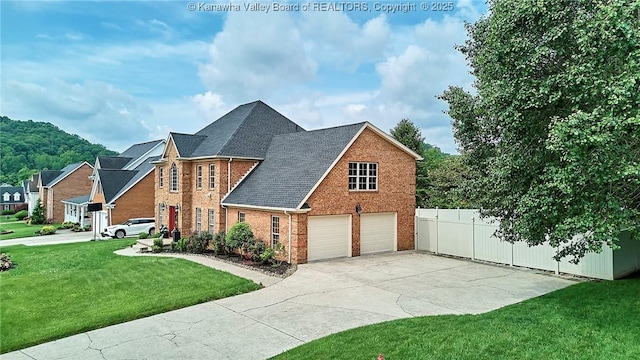 1004 Wethersfield Xing, Hurricane, WV 25526 - view of front facade featuring brick siding, concrete driveway, and a garage