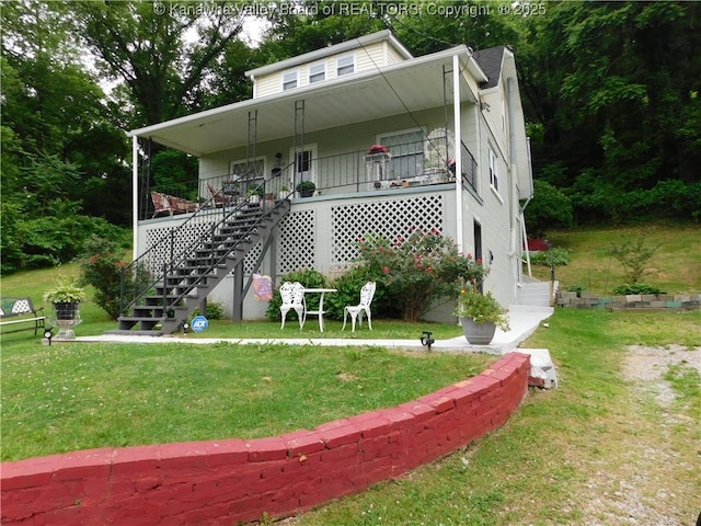 12910 Ohio Ave, Chesapeake, WV 25315 - bungalow-style home with stairway, a front lawn, and covered porch