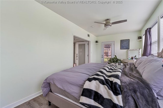 916 Amherst Dr, Charleston, WV 25302 - bedroom with wood finished floors, multiple windows, a ceiling fan, and access to outside