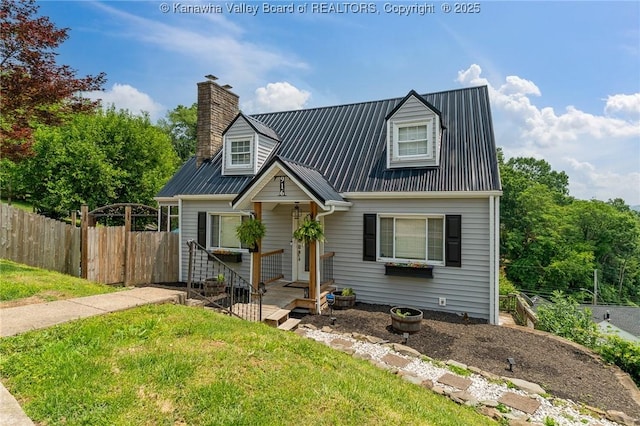 916 Amherst Dr, Charleston, WV 25302 - cape cod-style house with a metal roof and a chimney