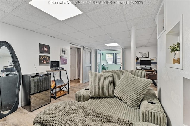 916 Amherst Dr, Charleston, WV 25302 - living area with a paneled ceiling, light wood-style floors, and an office area
