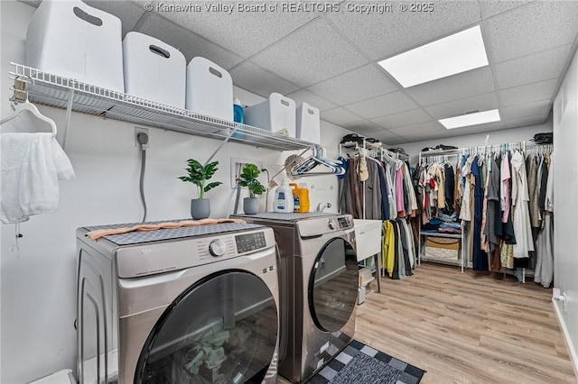916 Amherst Dr, Charleston, WV 25302 - washroom featuring washer and clothes dryer and light wood-style flooring
