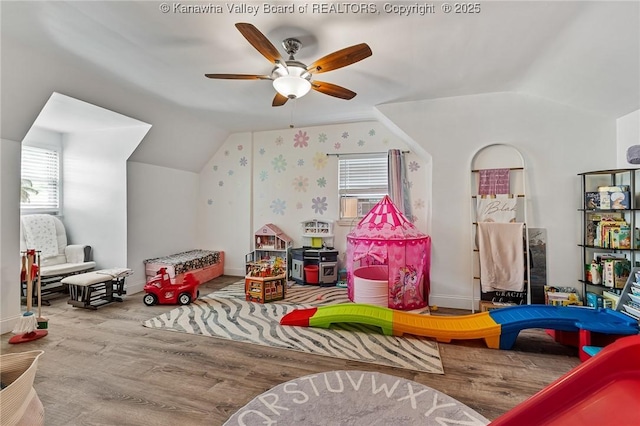916 Amherst Dr, Charleston, WV 25302 - playroom featuring lofted ceiling, ceiling fan, wood finished floors, and healthy amount of natural light