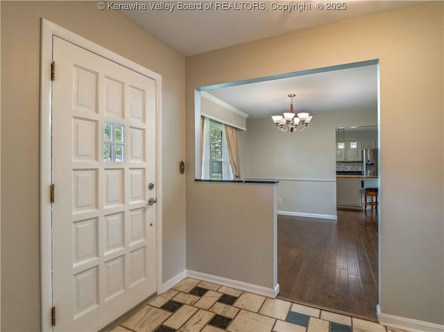 227 Maplewood Ests, Scott Depot, WV 25560 - foyer entrance featuring a chandelier and baseboards