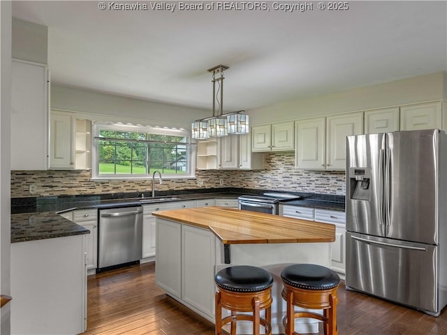 227 Maplewood Ests, Scott Depot, WV 25560 - kitchen featuring appliances with stainless steel finishes, wood counters, open shelves, and backsplash