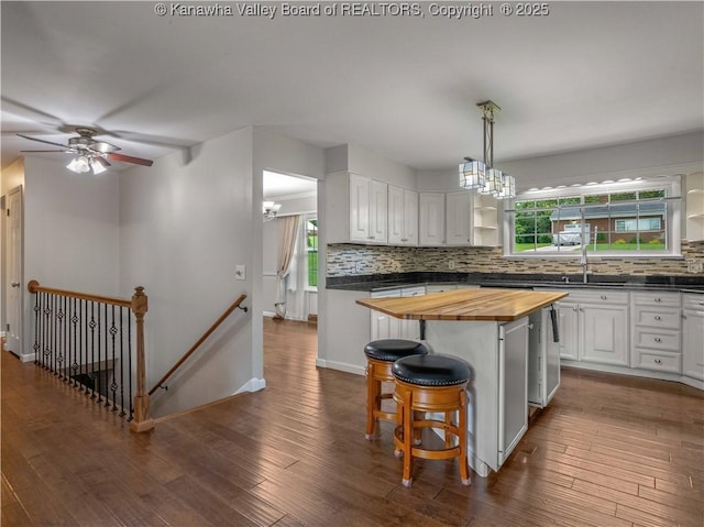 227 Maplewood Ests, Scott Depot, WV 25560 - kitchen featuring wooden counters, a chandelier, decorative backsplash, and a kitchen breakfast bar