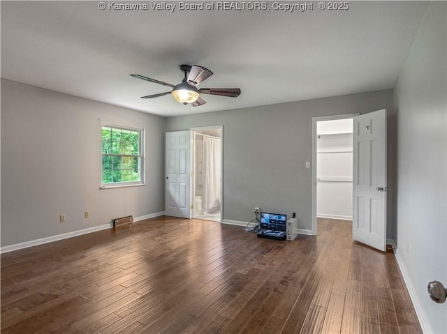 227 Maplewood Ests, Scott Depot, WV 25560 - unfurnished bedroom with a walk in closet, wood finished floors, ceiling fan, and ensuite bath