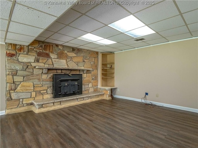 227 Maplewood Ests, Scott Depot, WV 25560 - unfurnished living room with wood finished floors, a drop ceiling, and built in features